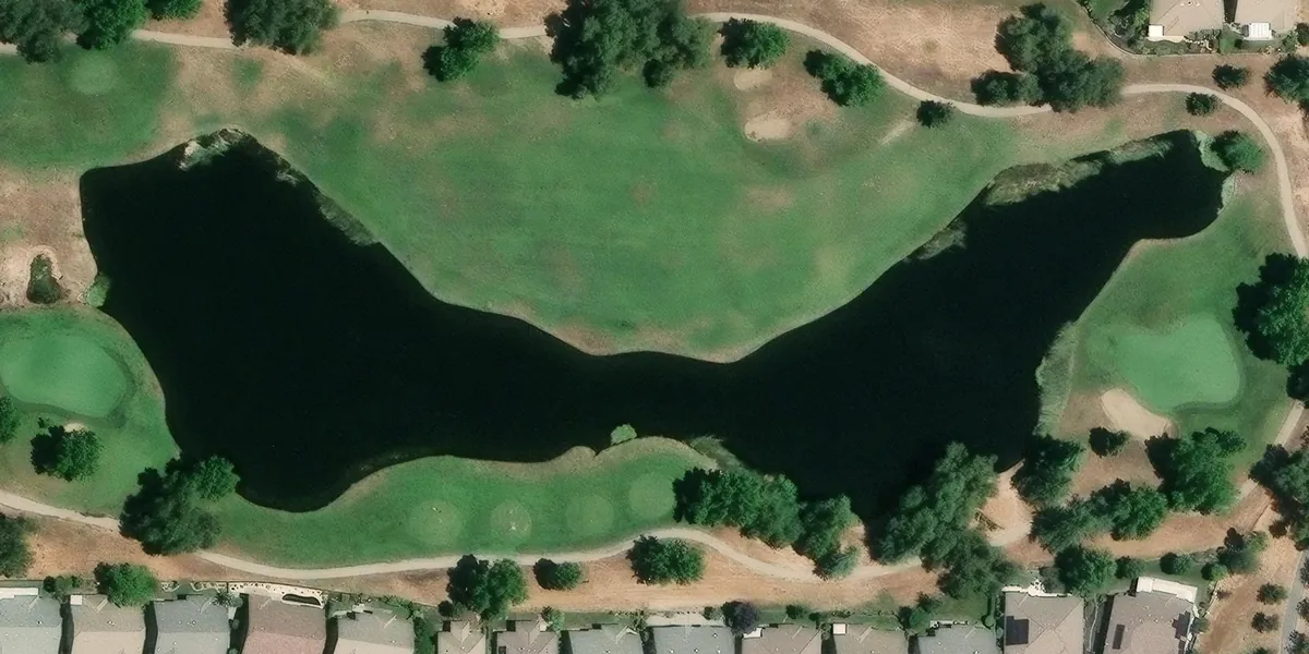 Satellite photo of a lake with its shoreline traced, LiDAR ground contours around it, and depth contours every 12 inches down to 48 inches